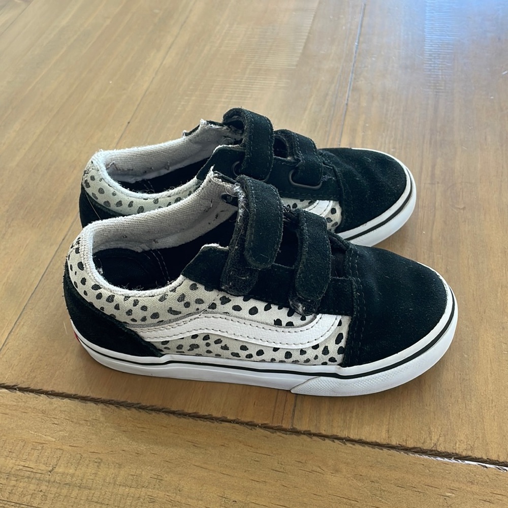 Vans black and white with black dots.